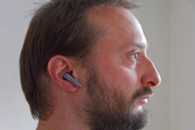 Man wearing EarFun Air 2 NC, side view